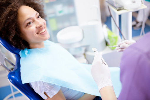 A woman smiling in dental chair at Roane Family Dental.