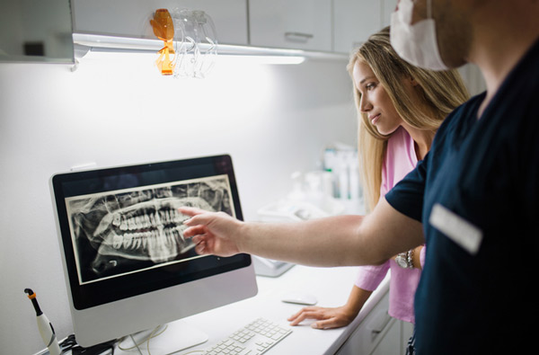 Dentist reviewing a digital xray in West Linn, OR at Roane Family Dental.