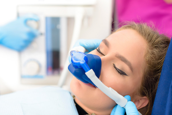 Sedated woman in dental chair at Roane Family Dental in West Linn, OR 97068-4310